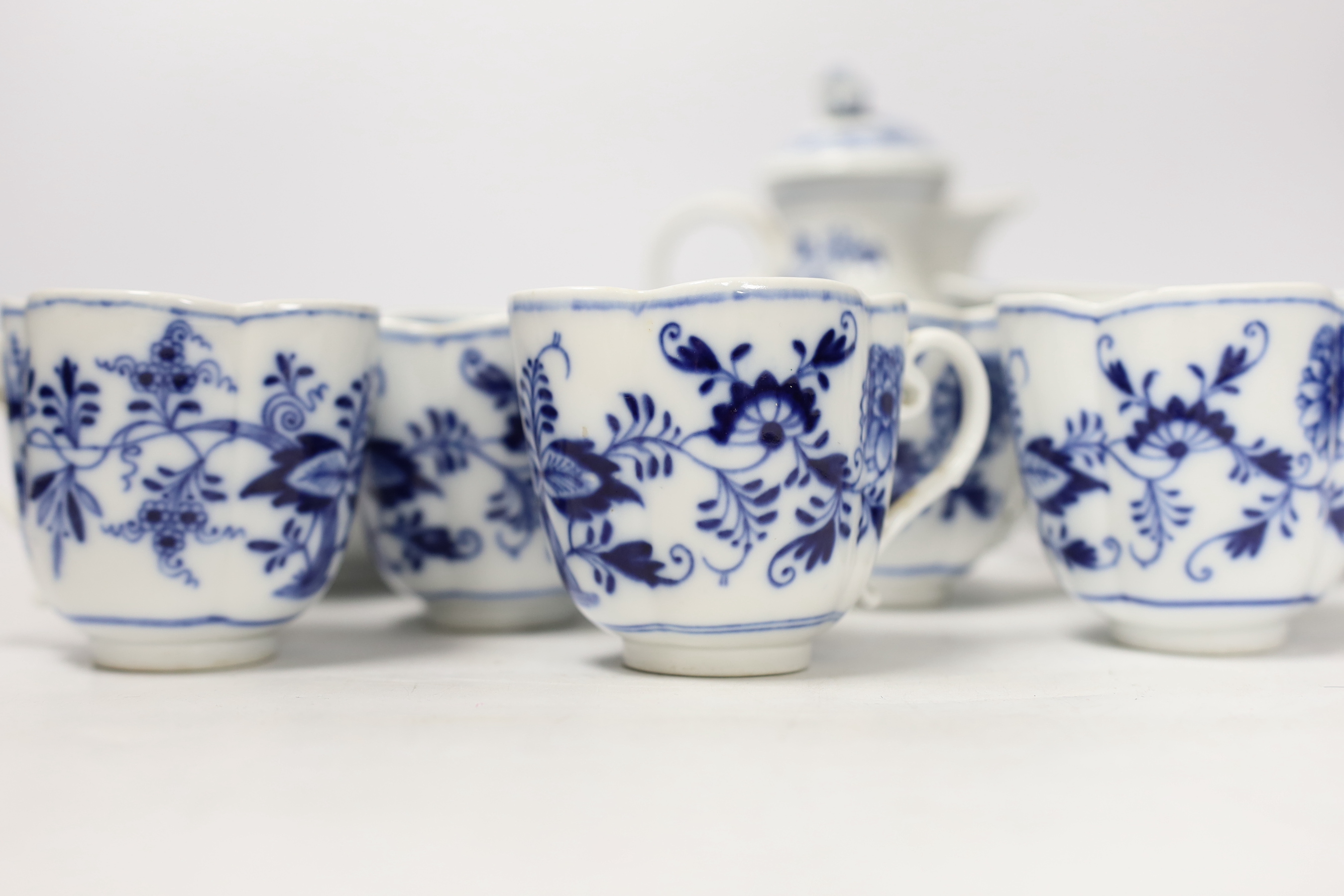 Fourteen Meissen items including a coffee pot, five cups and saucers, a square dish and oval dish, and a posy vase, coffee pot 16cm